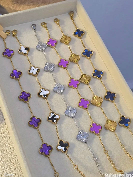 clover chain bracelets.The bracelets feature gold-plated chains with 5 clover charms ...black and white and silver in stock.